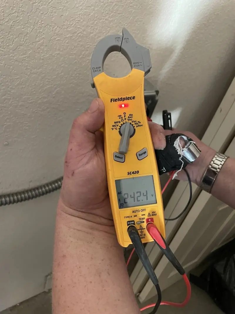 Voltage testing with clamp meter during Whole House Surge Protector in Anderson